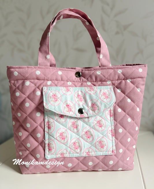 Rosa veske med prikker